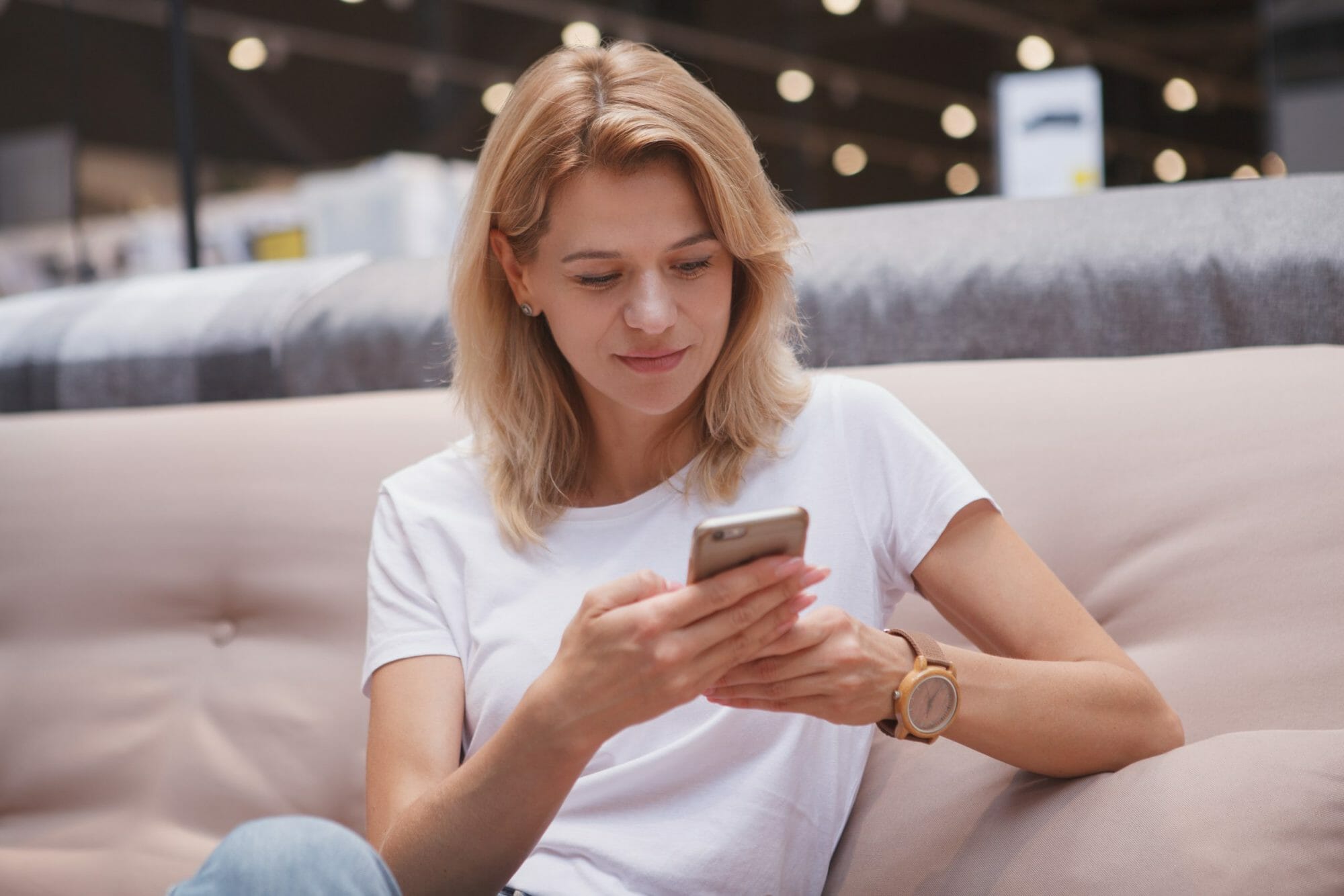 Woman-texting-at-store-810782-scaled